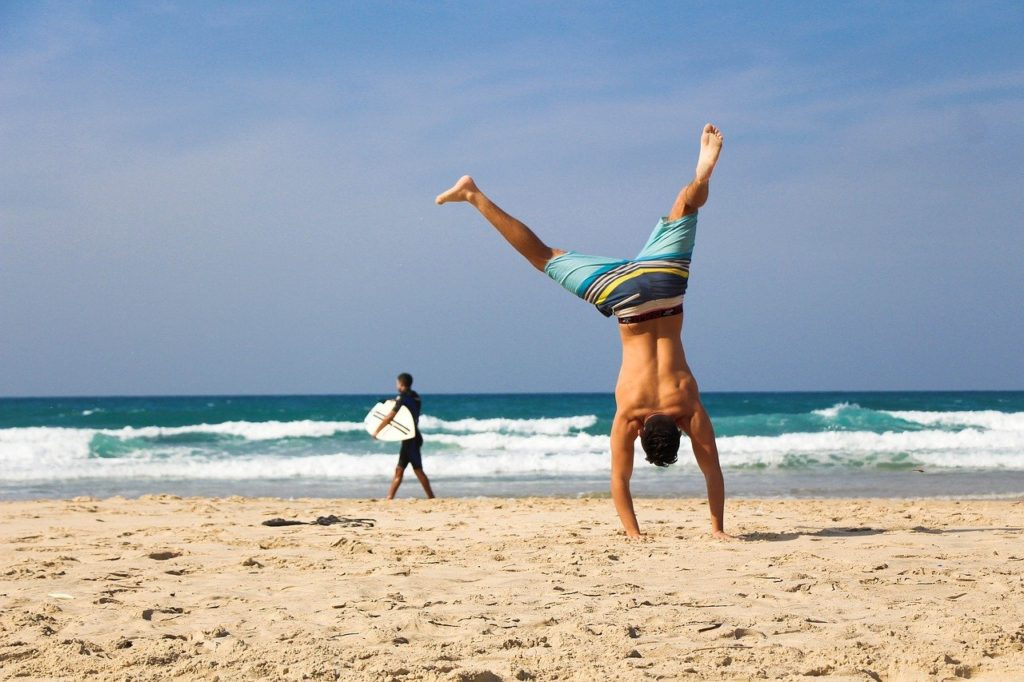 handstand, beach, sea
